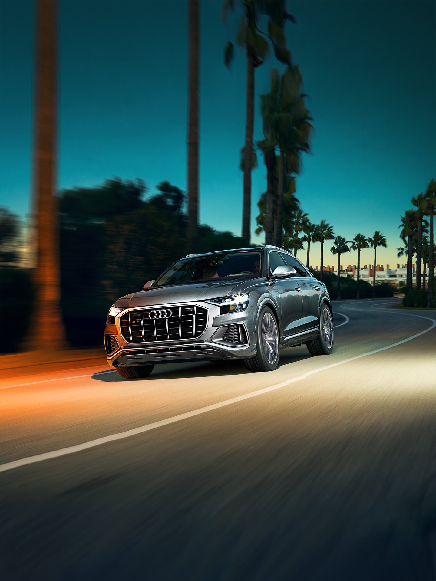 Three-quarter front view of the Audi SQ8 in motion.