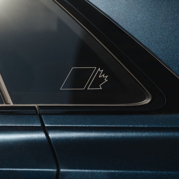 Close-up on the Maple Leaf Edition window decal on the rear window of an Audi SQ8.