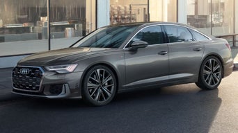Audi A6 sedan parked at Audi Dayton dealership, showcasing luxury styling and LED headlights 