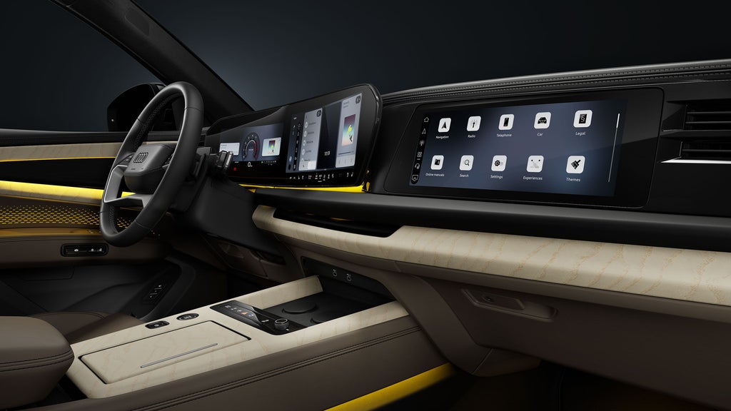 View from the passenger side of the cockpit, showing the steering wheel and the digital displays.