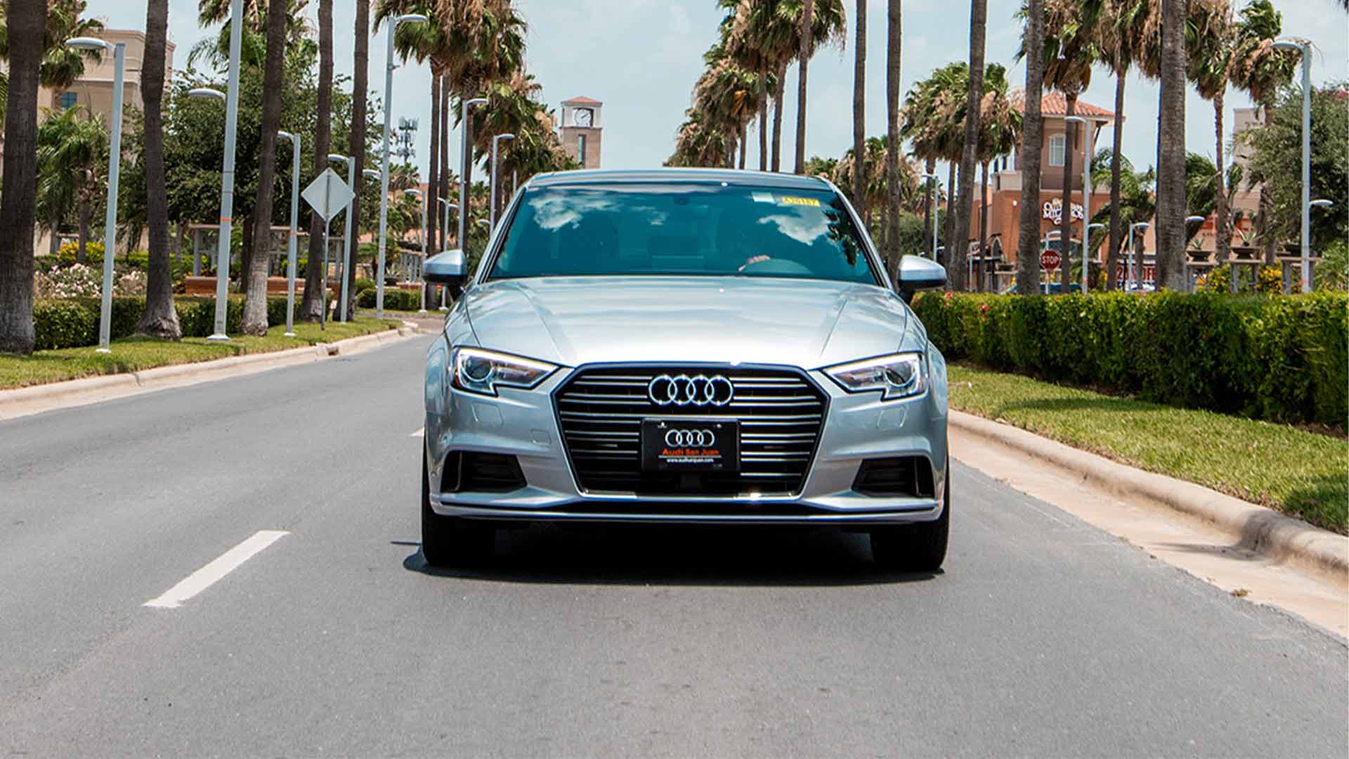 Front view of a silver Audi sedan accelerating