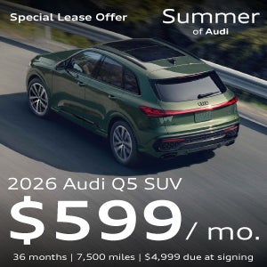A green Q5 parked.