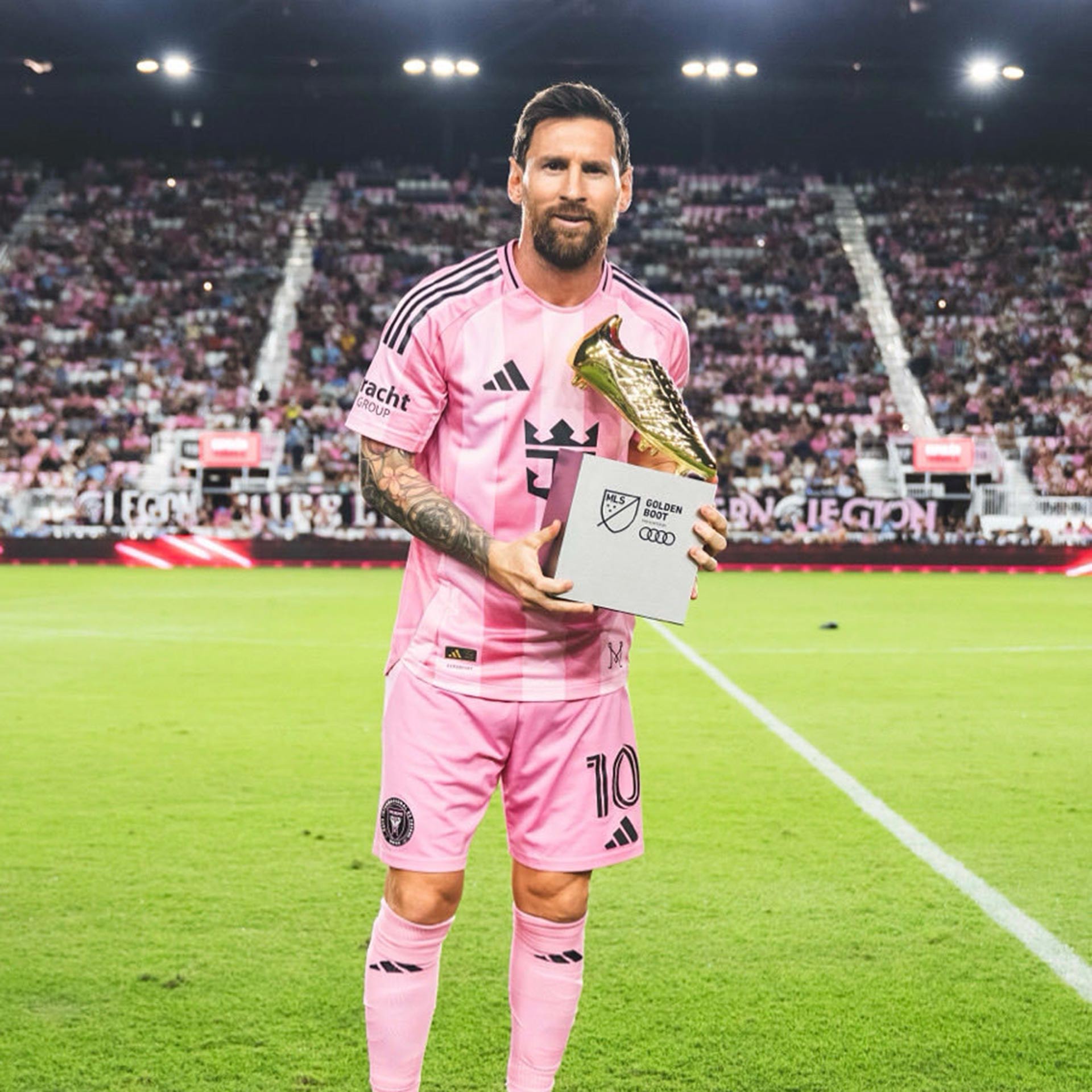 An image showcasing Denis Bouanga and the Audi MLS Golden Boot Award. 