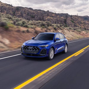 Three quarter view of an Audi Q5 driving on the highway