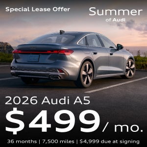 A gray A5 driving.