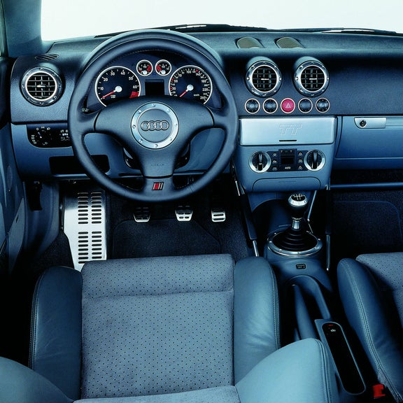 Interior view of the Audi TT Roadster steering wheel and dashboard.