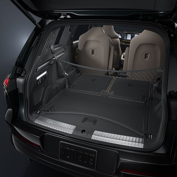 Close-up of the open trunk of the Audi Q9 SUV. The focus is on the stretched luggage net.