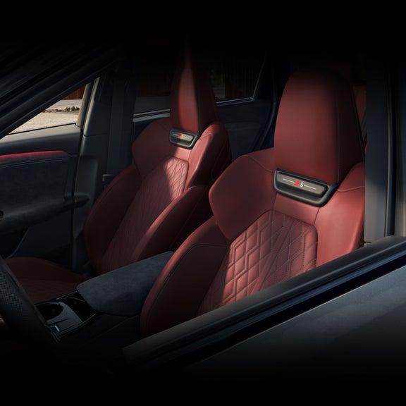 Interior view of the Audi SQ6 e-tron, showing the driver and passenger seats.