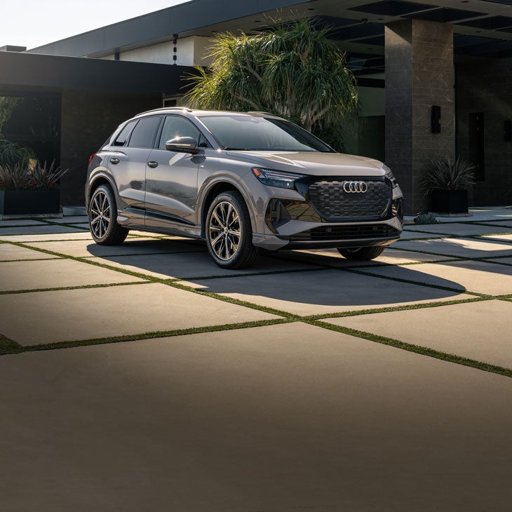 Three-quarter front view of the Audi Q4 e-tron parked. 