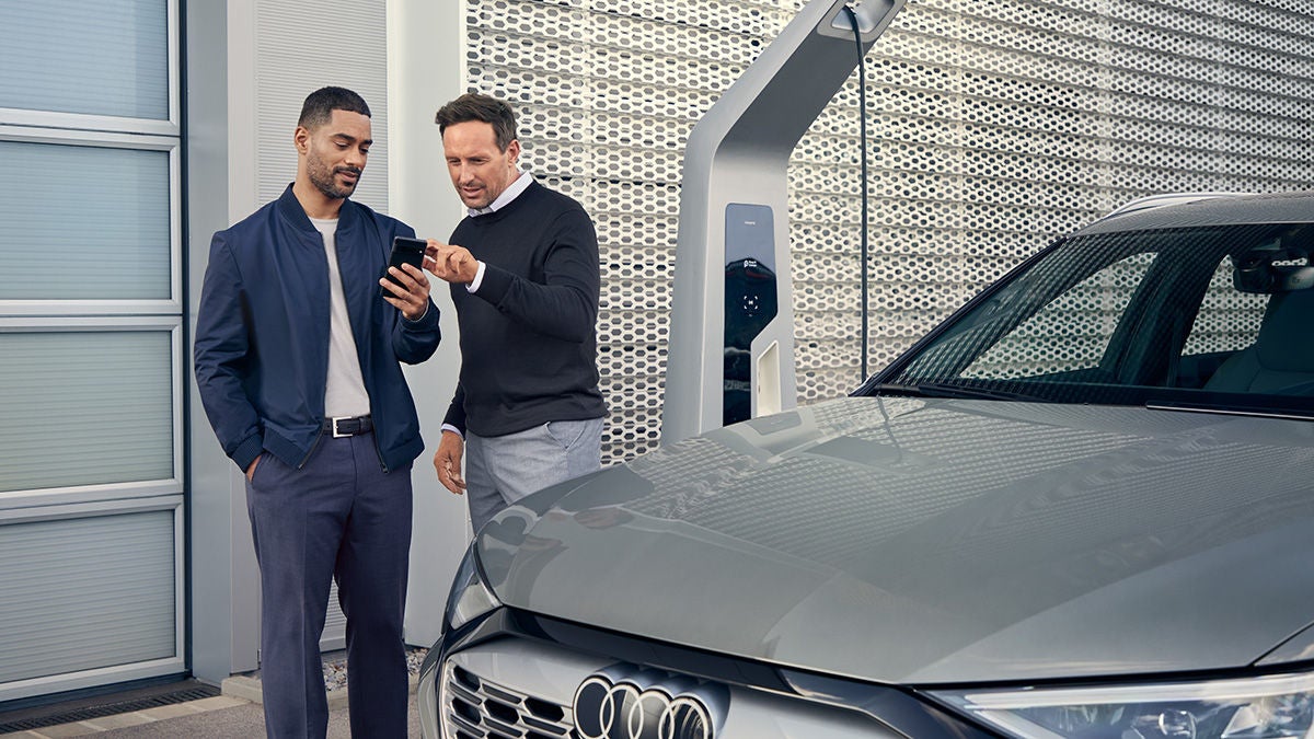 Man getting into an Audi A6.