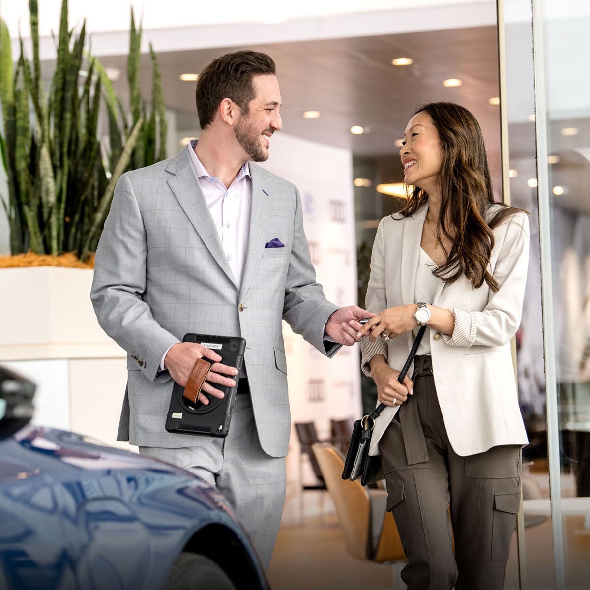 Customer and sales person at Audi dealership