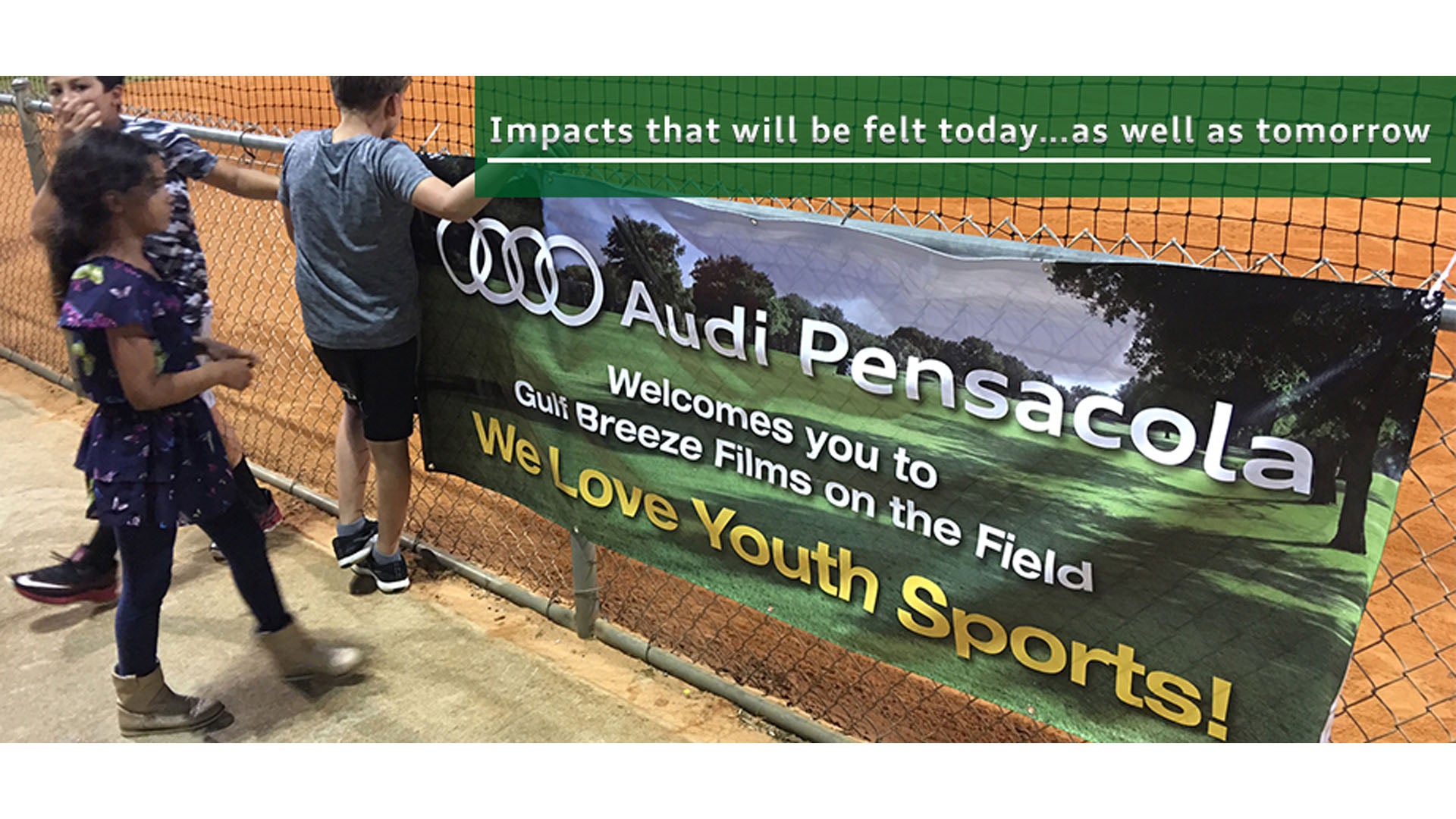 image of children at a baseball diamond sponsored by Audi Pensacola