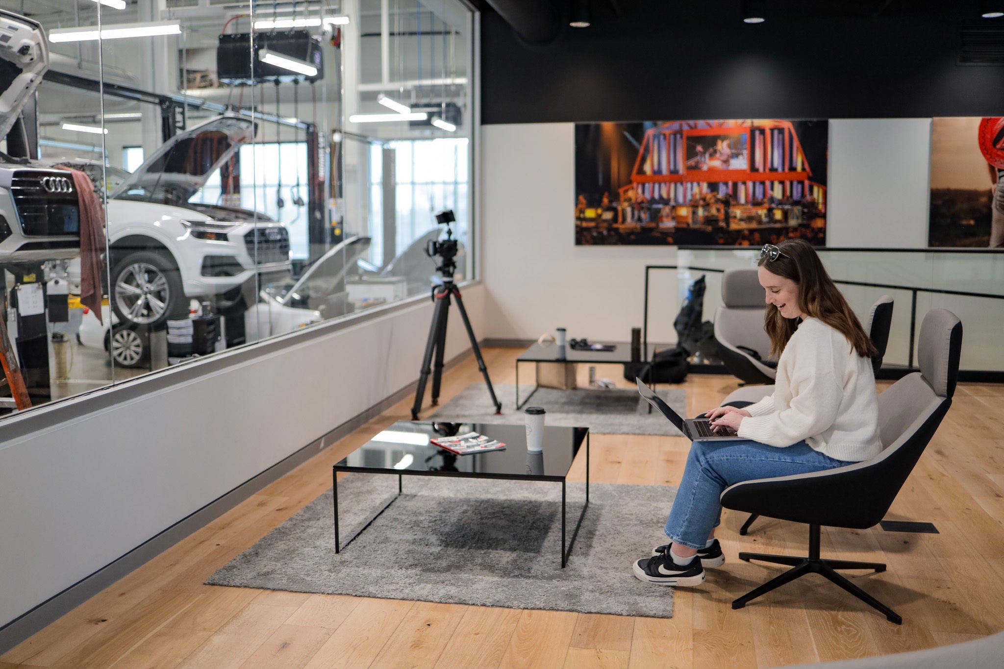 Audi service technician servicing a vehicle.