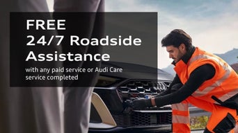 Service technician repairing vehicle.