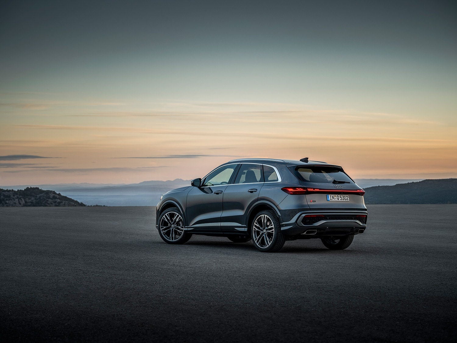 Profile view of Audi vehicle. 