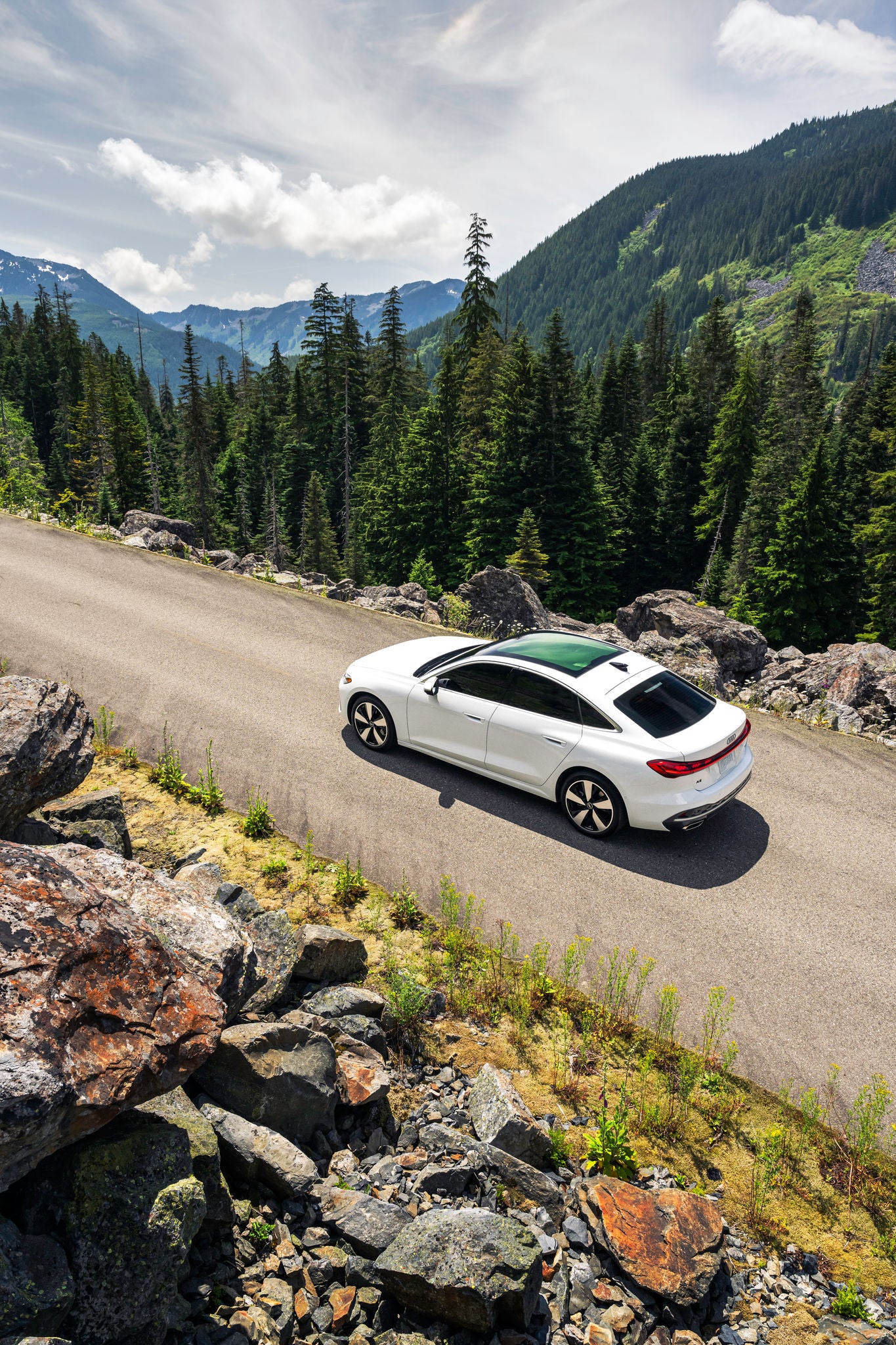 Audi 2025 Audi Q6 e-tron left profile driving.