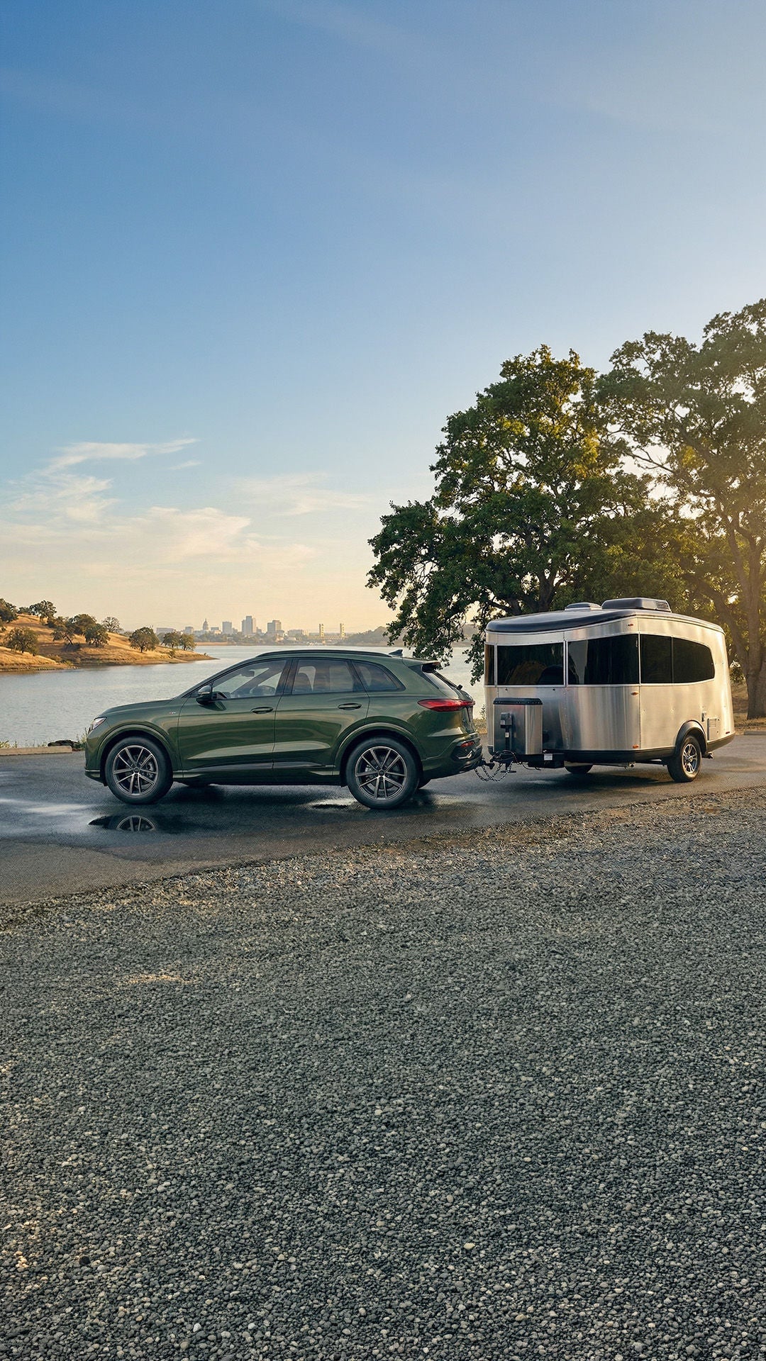 2026 Audi Q5 towing a Airsteam Bambi with the Sacramento skyline in the background