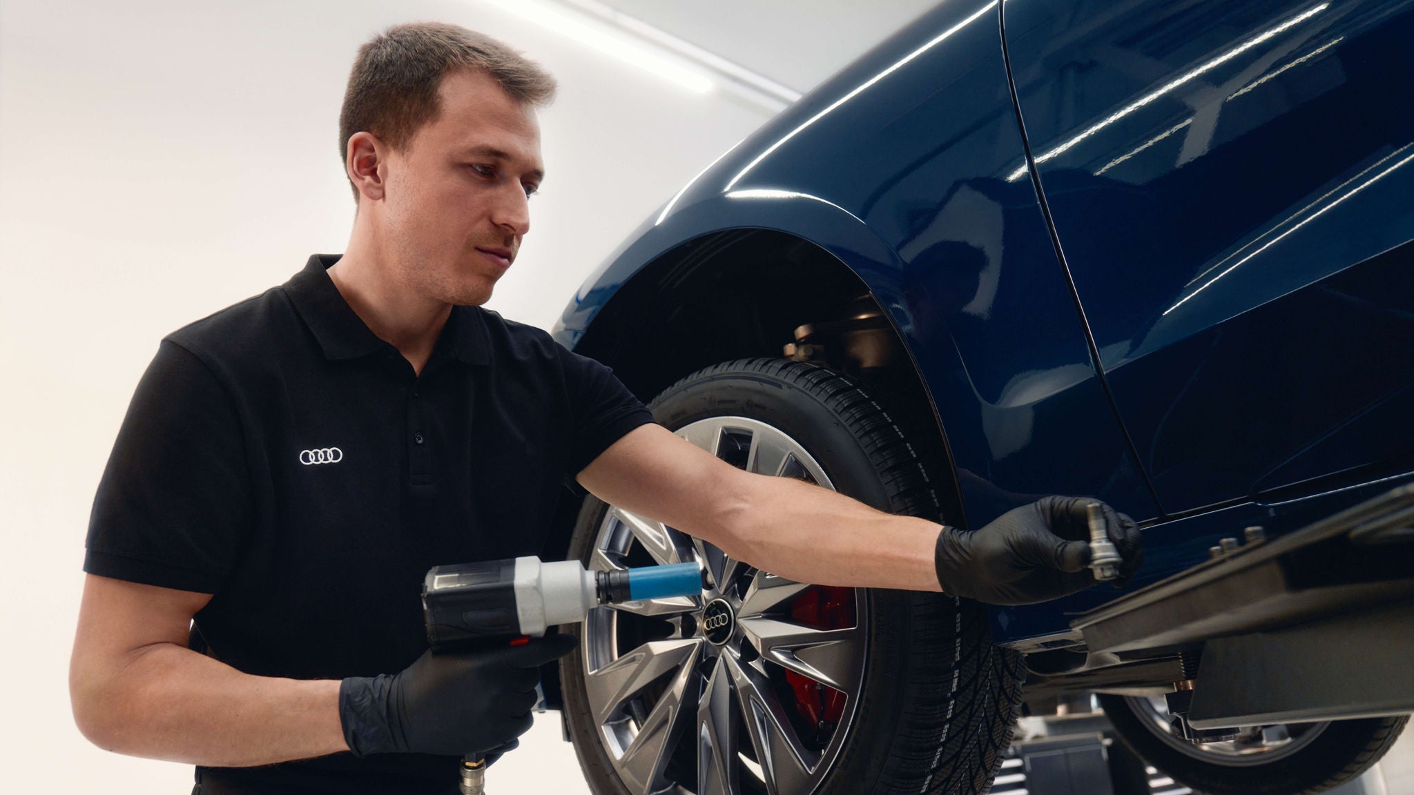 Audi vehicle having its seasonal tires changed at Audi Moncton.