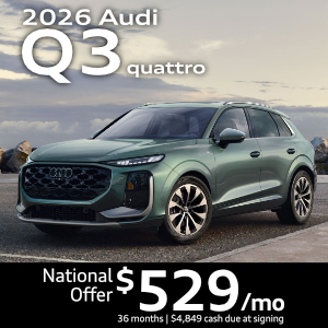 Side view of an Audi Q3 driving.