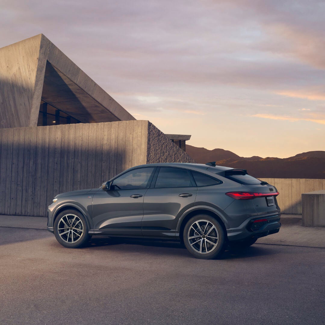 2026 Audi Q5 Sportback Exterior Parked In Front Of Large Angular House