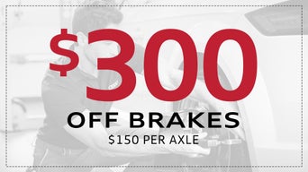 Service technician servicing vehicle. 