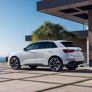 Back view of an Audi Q3 parked.