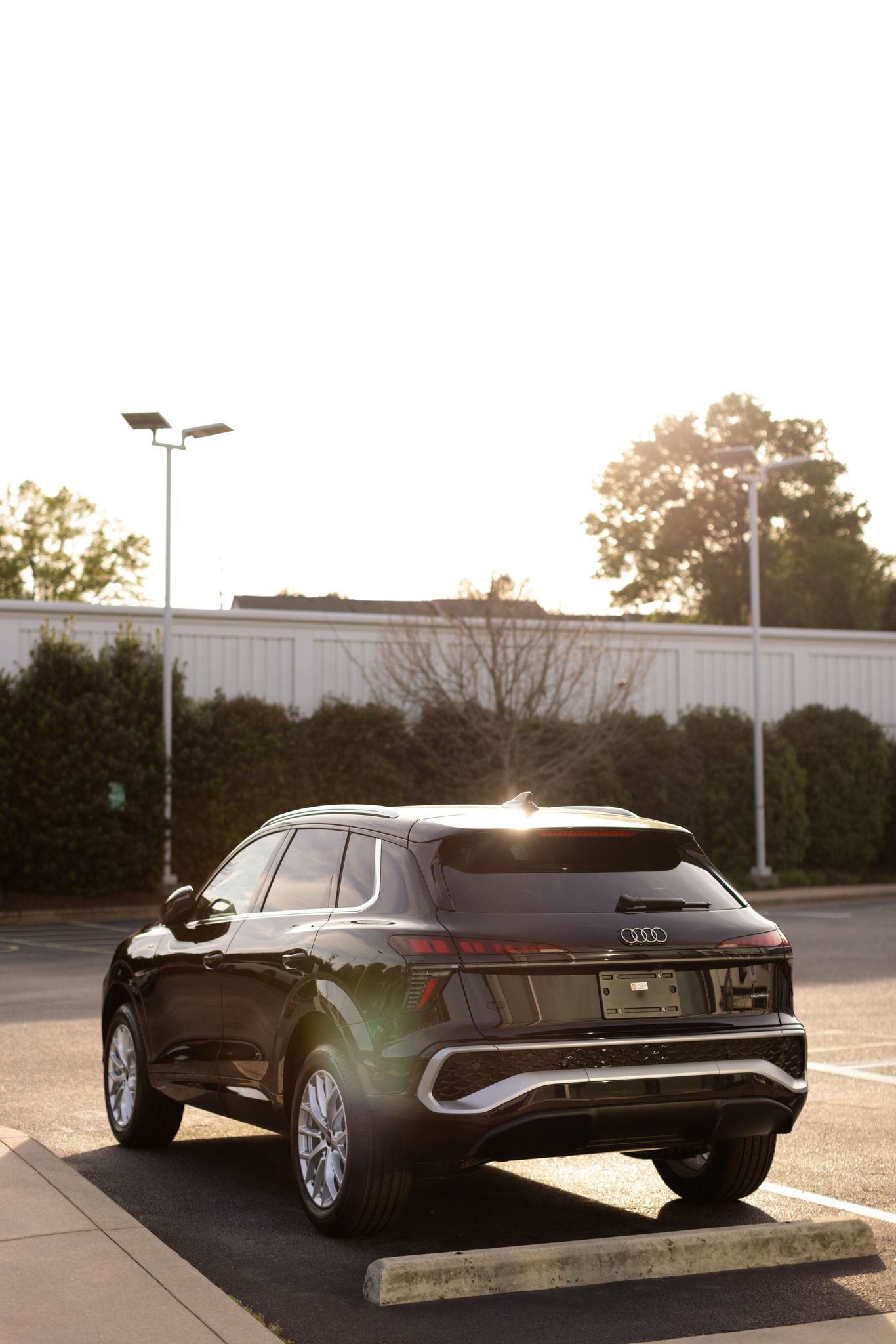 Audi 2025 Audi Q6 e-tron left profile driving.