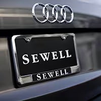 Back of Audi vehicle with Sewell license plate frame.