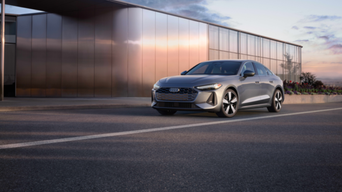 Three quarter view of an Audi A5 accelerating.