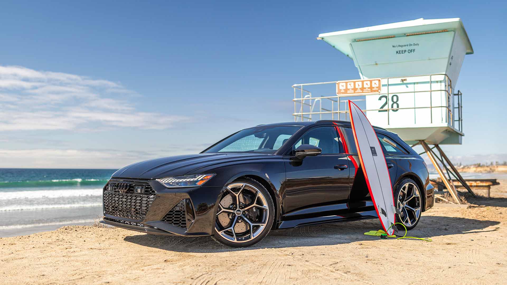 Side profile view of an Audi vehicle parked.