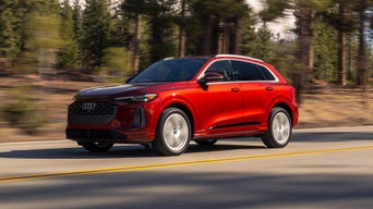 Audi Q5 driving down the road