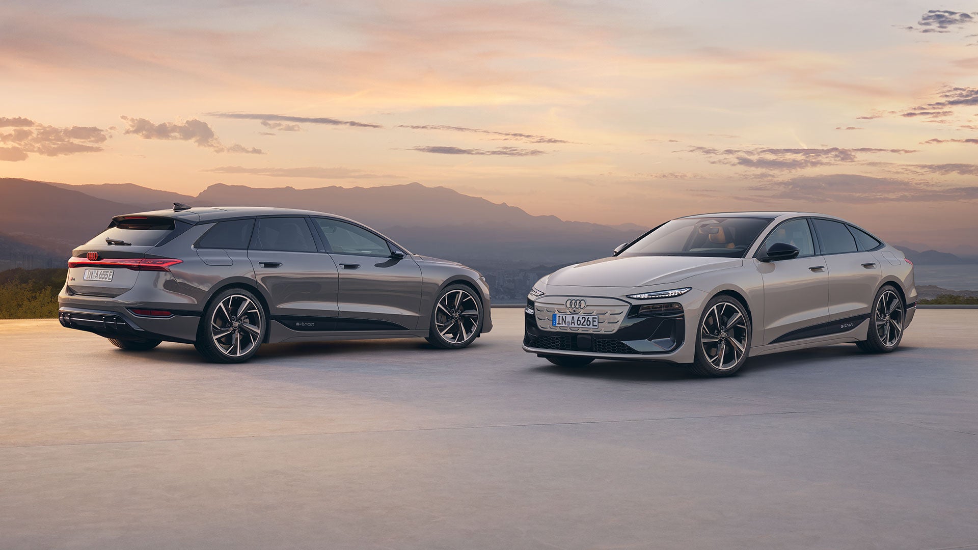 Three-quarter front view of the Audi A5, Q5, and Q7 parked side by side facing image left.