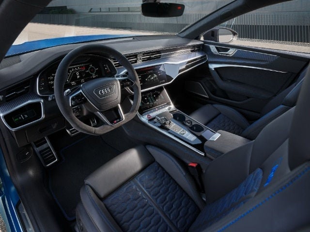 Audi RS7 premium interior featuring leather sport seats and tech‑focused layout