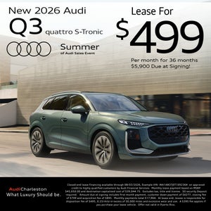 Side view of an Audi Q3 driving.