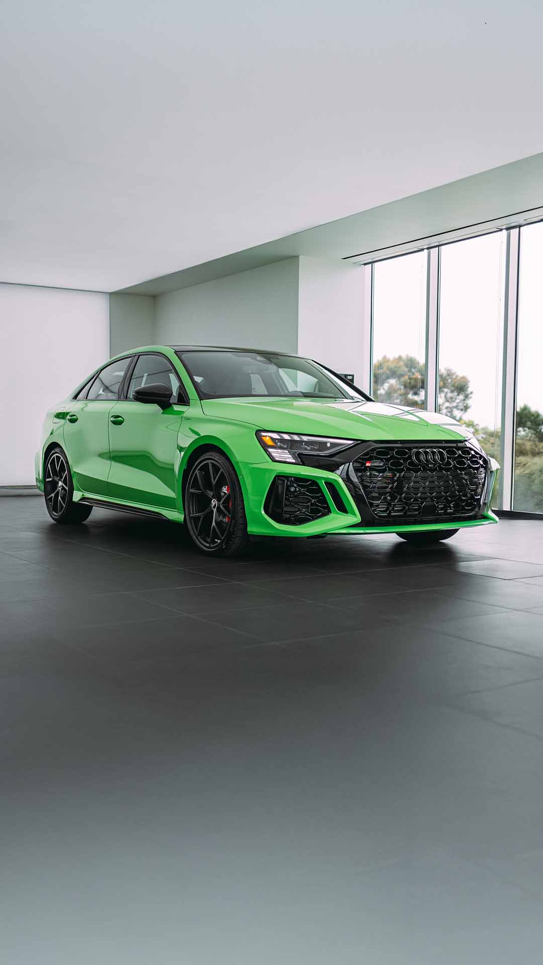 Side profile view of an Audi vehicle parked.