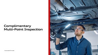 Technician inspecting a vehicle