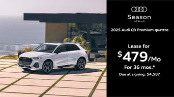 Q3 parked by a building