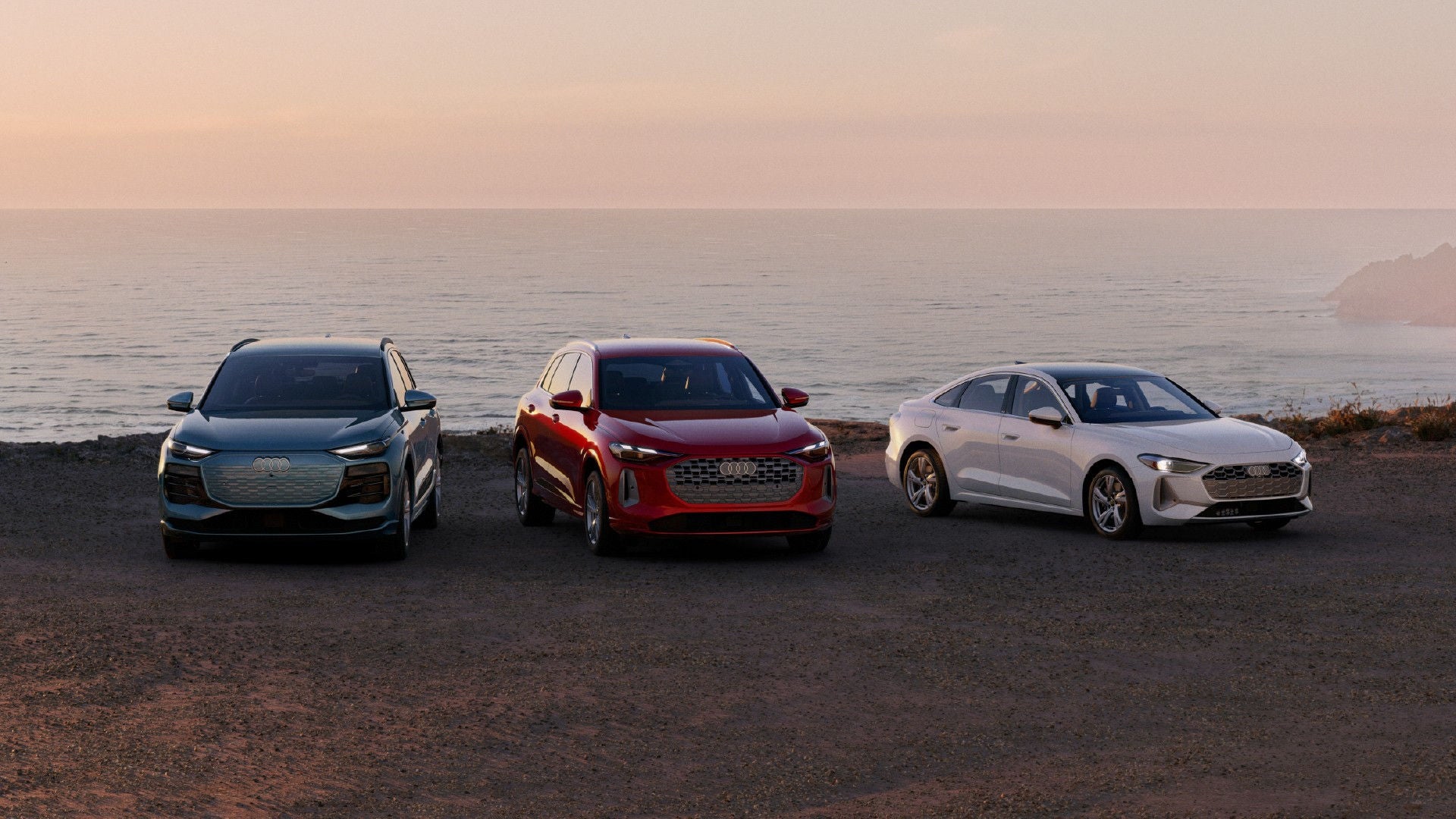 3 audi on a beach