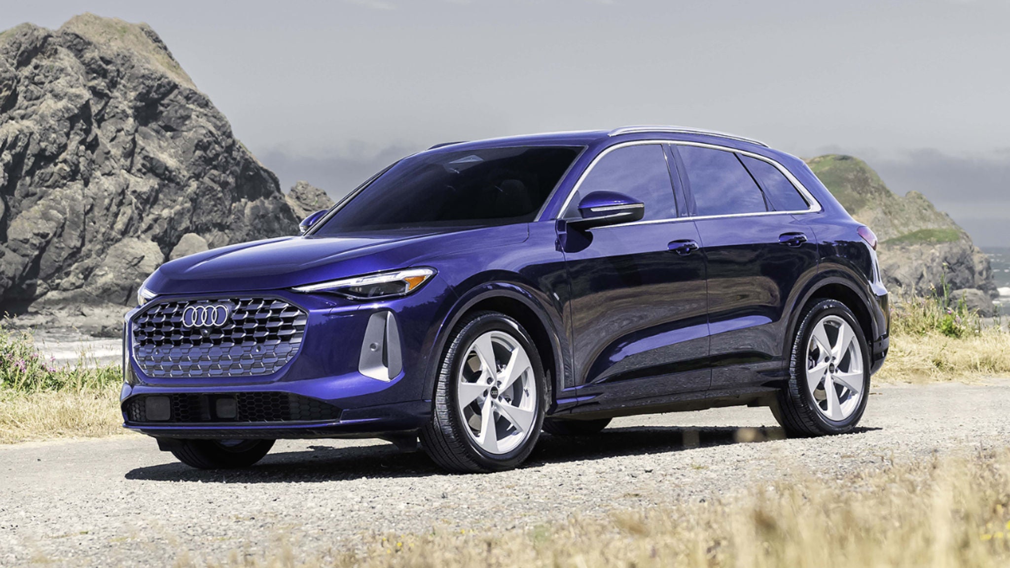 Side profile view of an Audi Q5 parked.