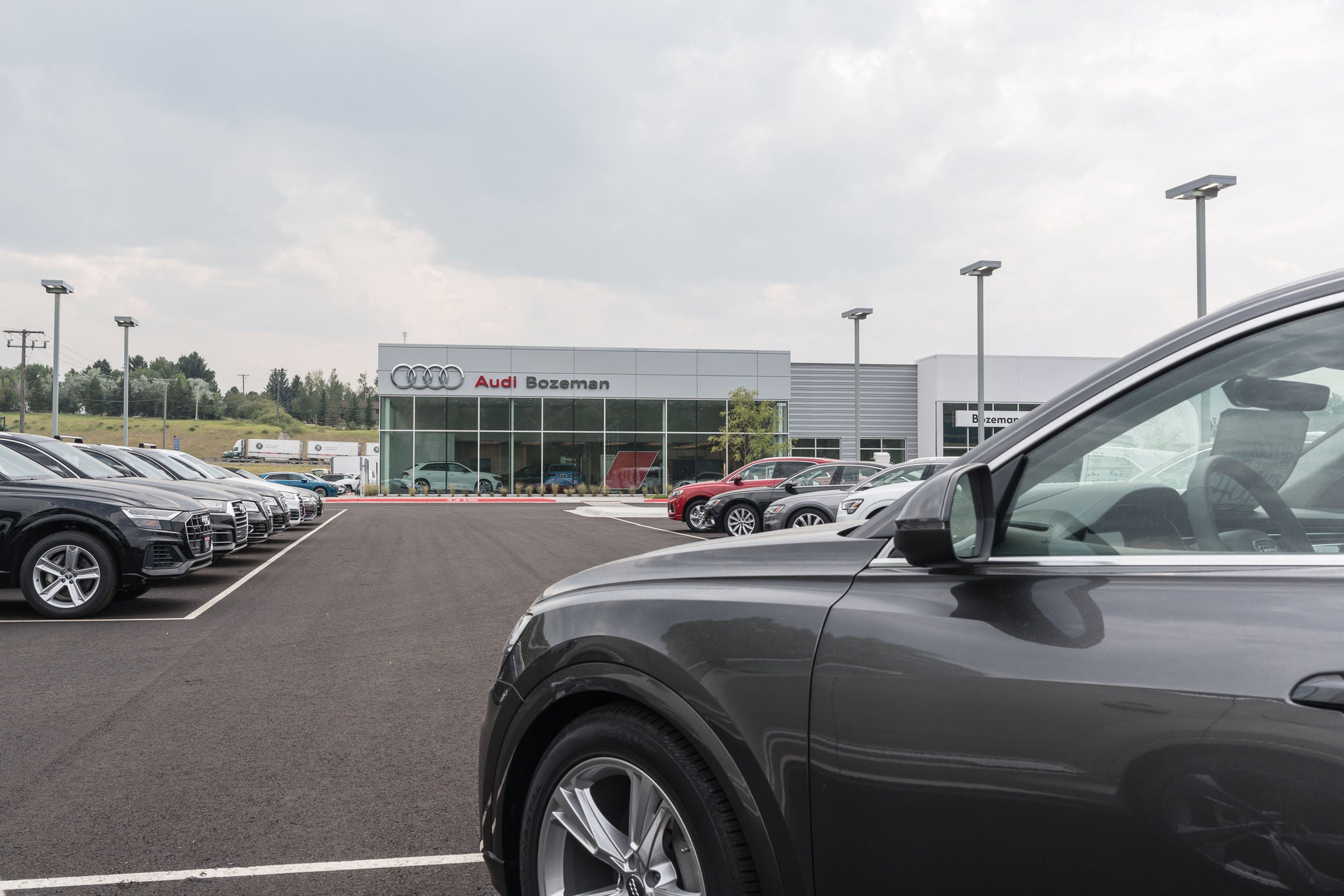 Audi vehicle in Audi Bozeman dealership parking lot.
