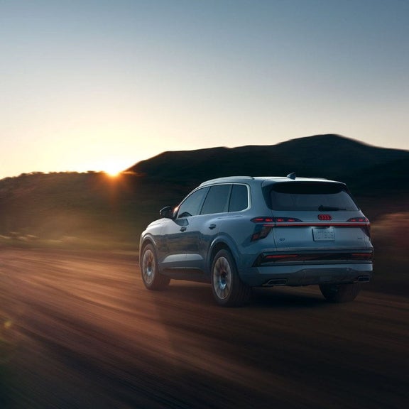 Rear three-quarter view of the 2027 Audi Q7 in motion
