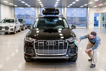 mechanic polishing audi
