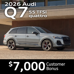 Side view of an Audi Q7 driving.