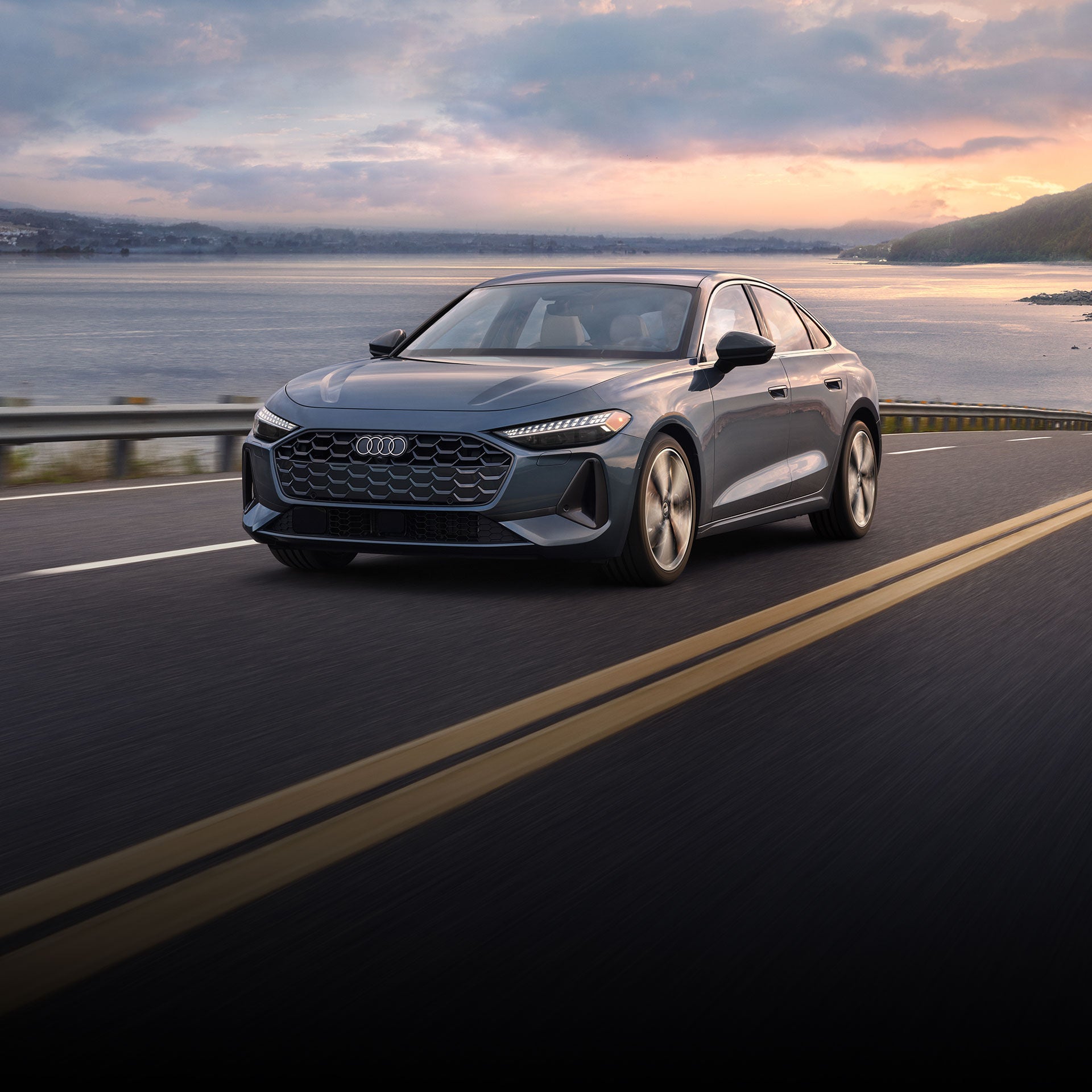 Three-quarter front-view of the all-new Audi A5 accelerating.