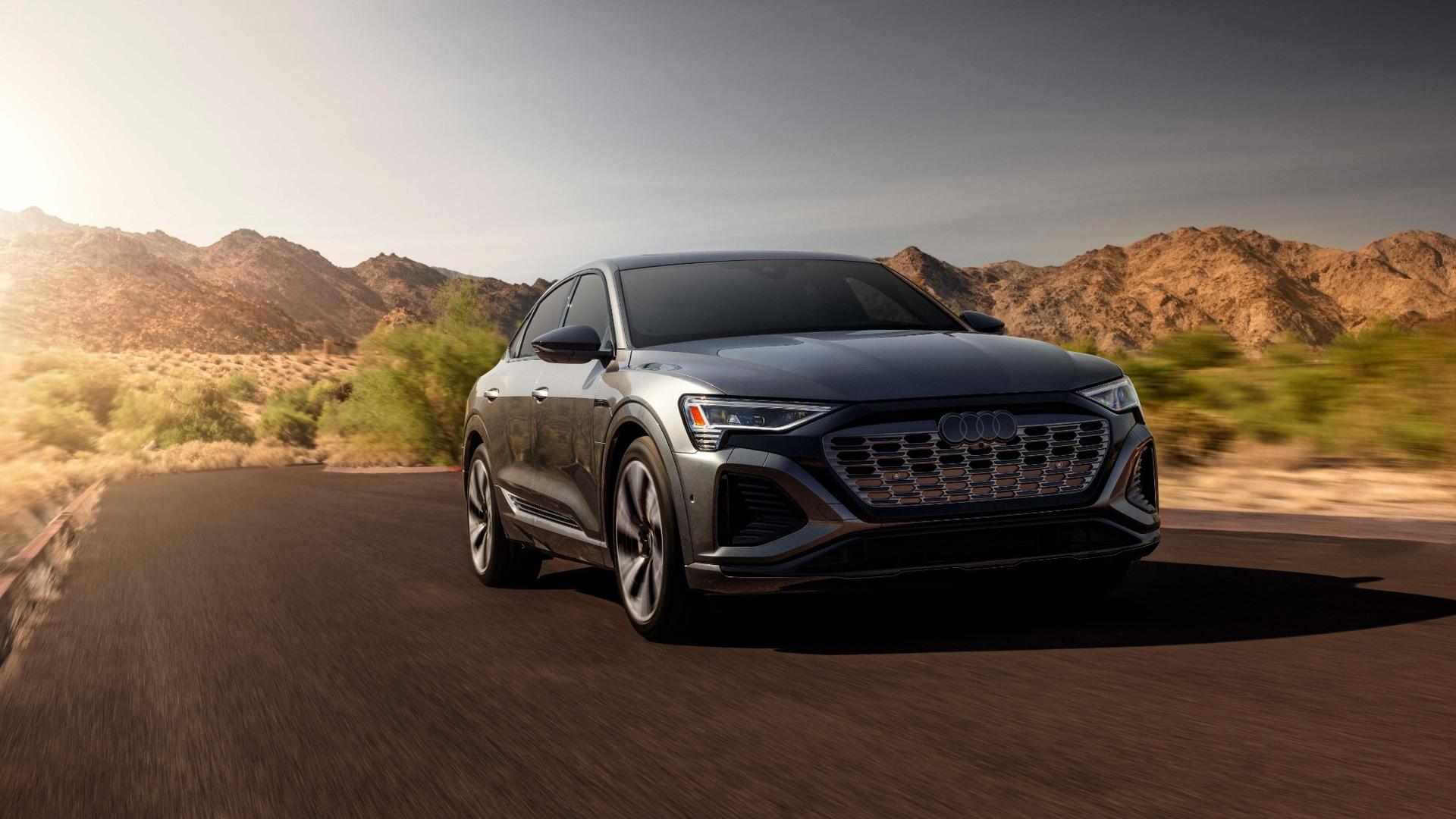 Front profile view of an Audi Q8 e-tron accelerating.