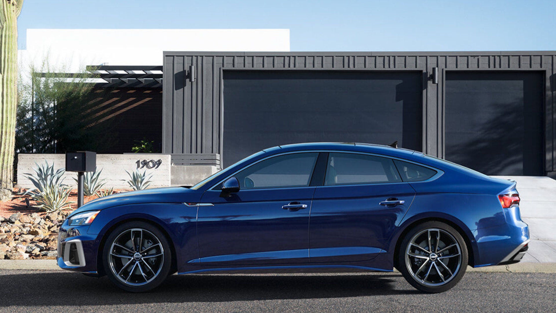 2025 Audi A5 Sportback Exterior Parked In Front Of Desert Home