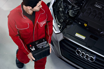Audi technician servicing a vehicle 