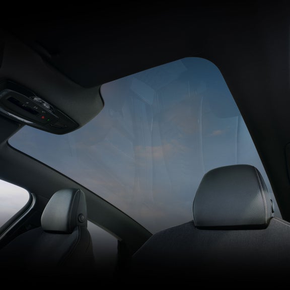 Interior view of the Audi S6 e-tron, showing the panoramic glass roof.