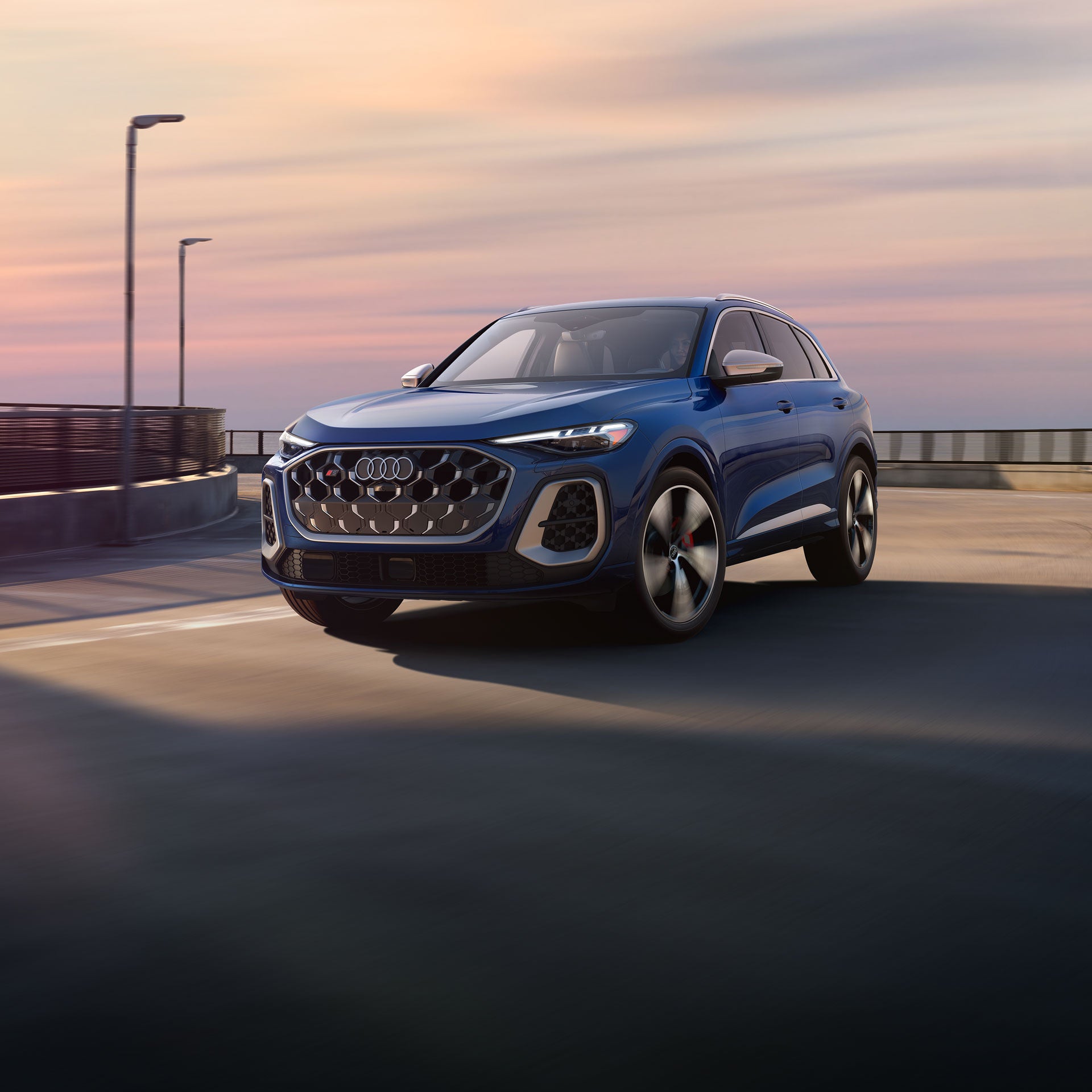 Three-quarter front view of the Audi SQ5 in motion.