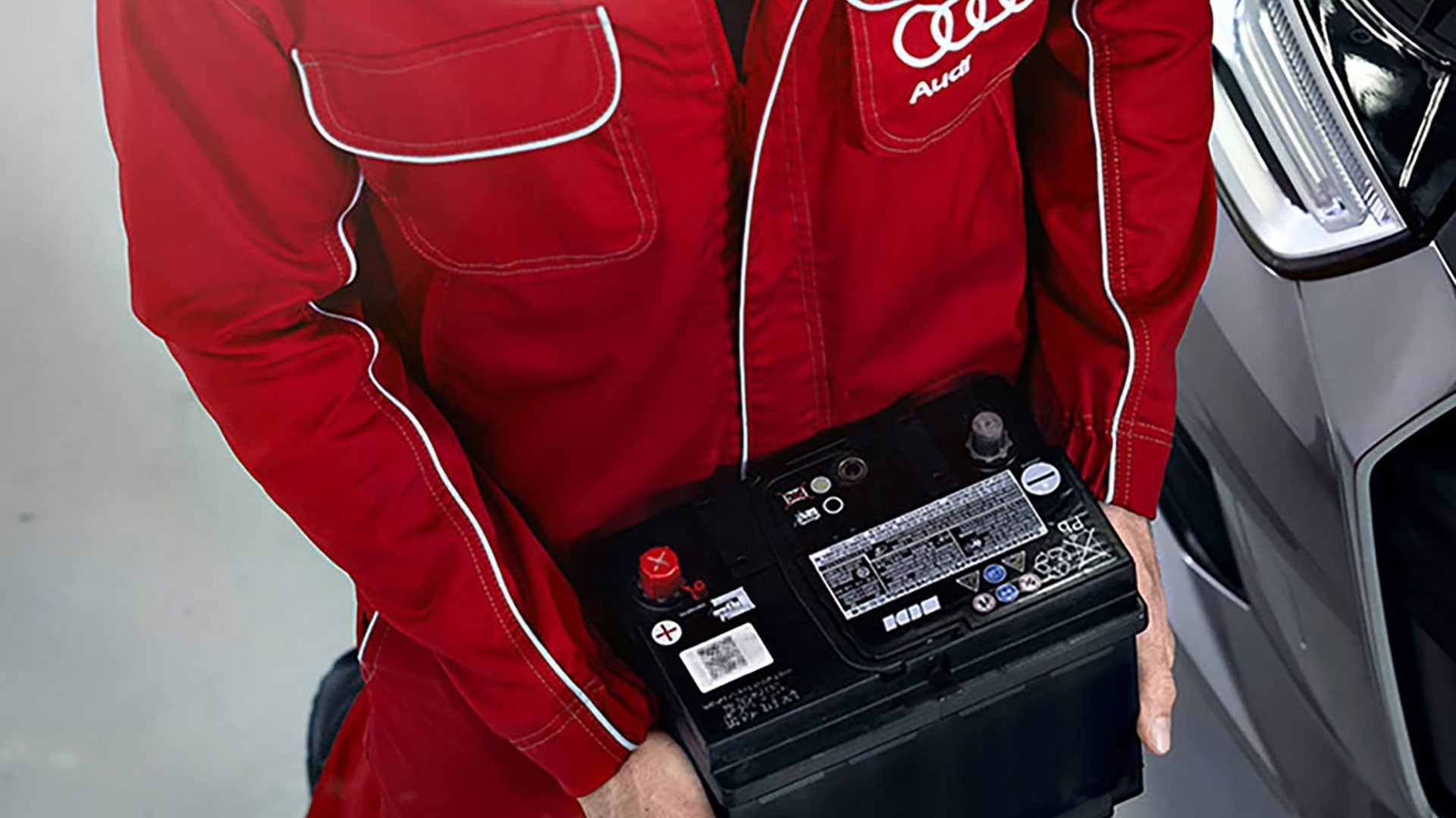 Audi mechanic transporting OEM battery